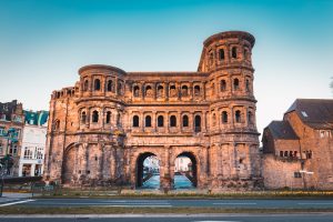 The Porta Nigra, a monumental Roman city gate, stands in Trier, Germany.