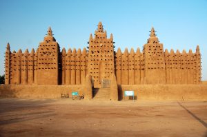 The Great Mosque of Djenné in Mali stands as a monumental adobe structure in the heart of the city.