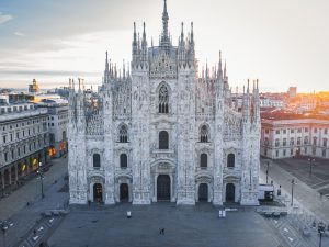 Exterior view of Milan Cathedral on Piazza del Duomo in Milan, photographed from the square at a mid-level height.