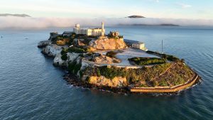 Alcatraz Island appears isolated in San Francisco Bay in the United States, seen from an aerial perspective.
